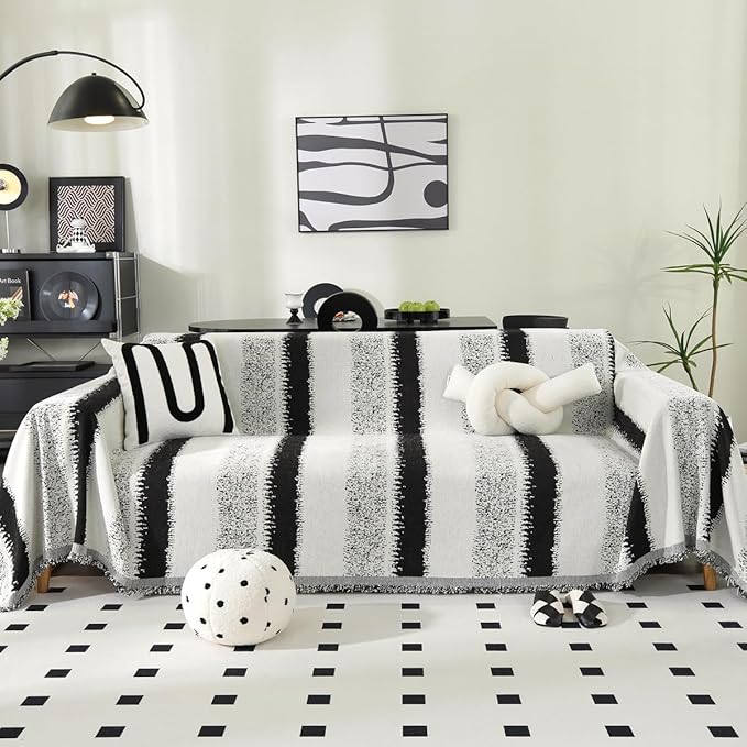 Boho-style black and white striped oversized chenille couch cover, washable and reversible, pet-friendly and pill-resistant slipcover for large sofas.